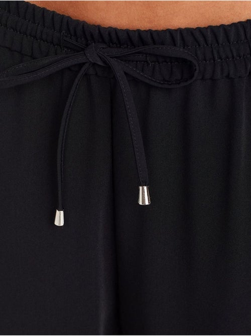 Pantaloni in crêpe a gamba ampia - Kiabi Pantaloni in crêpe a gamba ampia - Kiabi