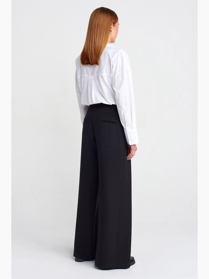 Pantaloni in crêpe a vita alta a gamba ampia da donna dilvin Nero - Kiabi