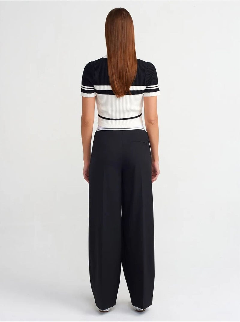 Pantaloni in crêpe a vita alta a gamba ampia dilvin Nero - Kiabi