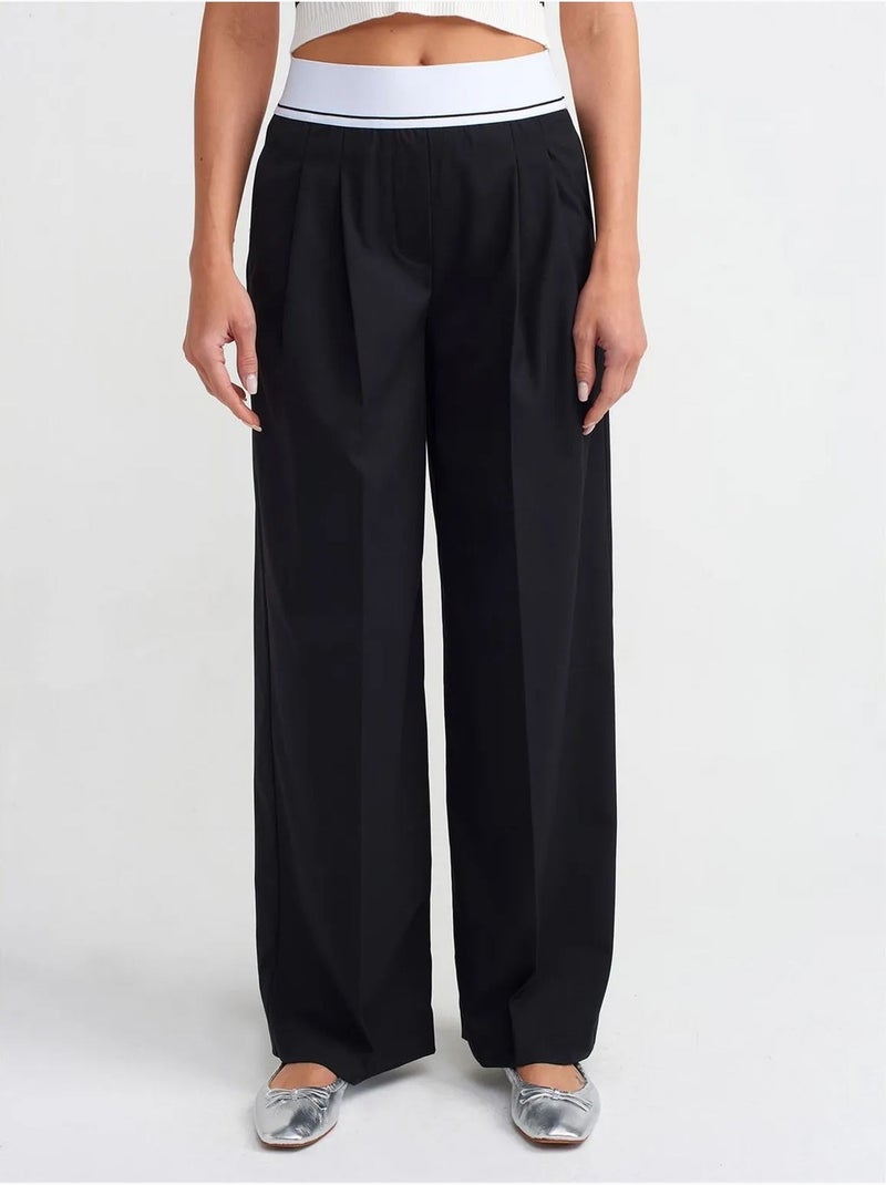 Pantaloni in crêpe a vita alta a gamba ampia dilvin Nero - Kiabi