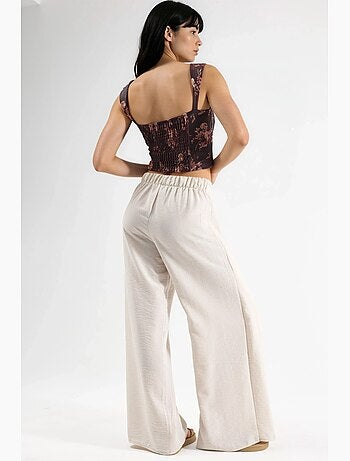 Pantaloni in crêpe con vita a coulisse e dettaglio con laccio busem