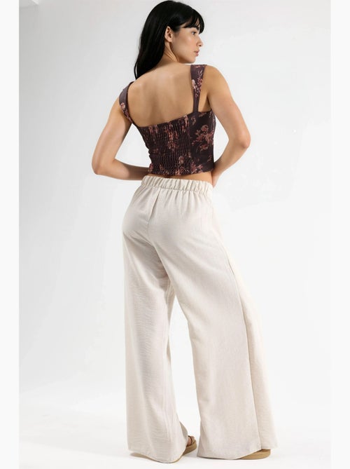 Pantaloni in crêpe con vita a coulisse e dettaglio con laccio busem - Kiabi Pantaloni in crêpe con vita a coulisse e dettaglio con laccio busem - Kiabi