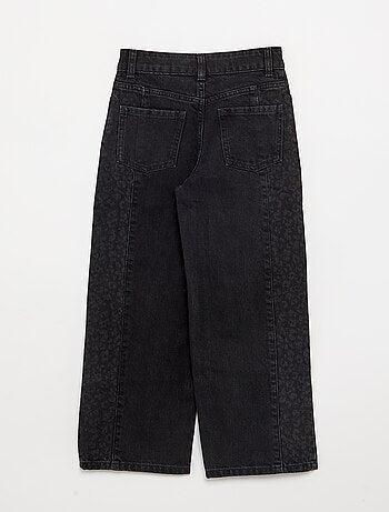 Pantaloni in denim con inserti stampati