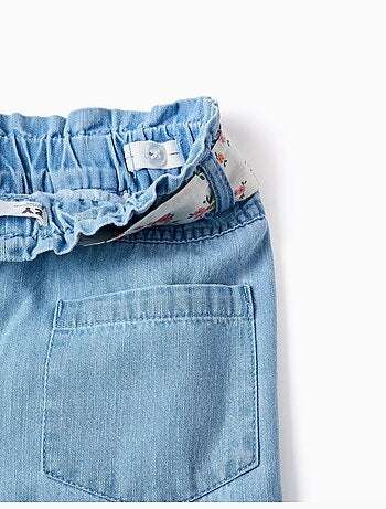 Pantaloni in jeans a gamba larga con cintura floreale