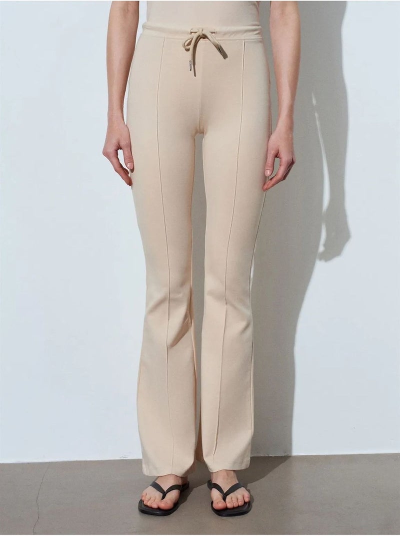 Pantaloni in jersey a zampa a vita media con coulisse dilvin Beige argilla - Kiabi