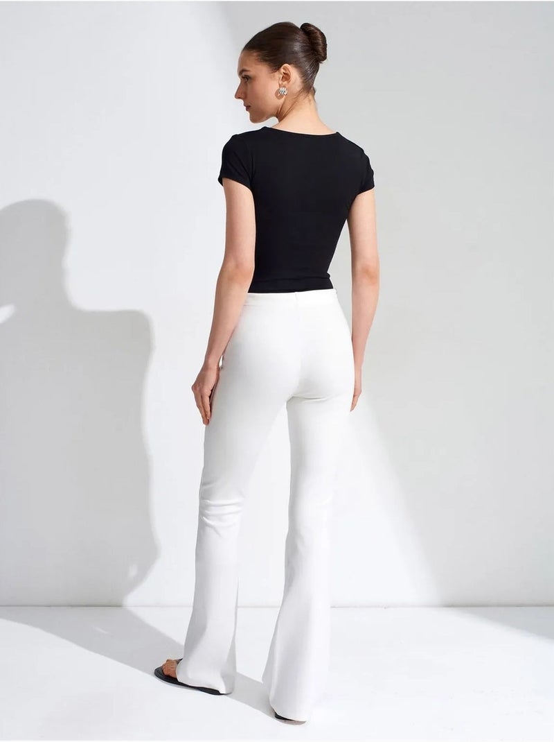 Pantaloni in jersey a zampa a vita media con coulisse dilvin Bianco - Kiabi