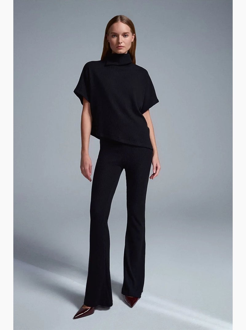 Pantaloni in maglia a zampa a vita alta dilvin Nero - Kiabi