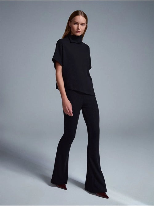 Pantaloni in maglia a zampa a vita alta - Kiabi Pantaloni in maglia a zampa a vita alta - Kiabi