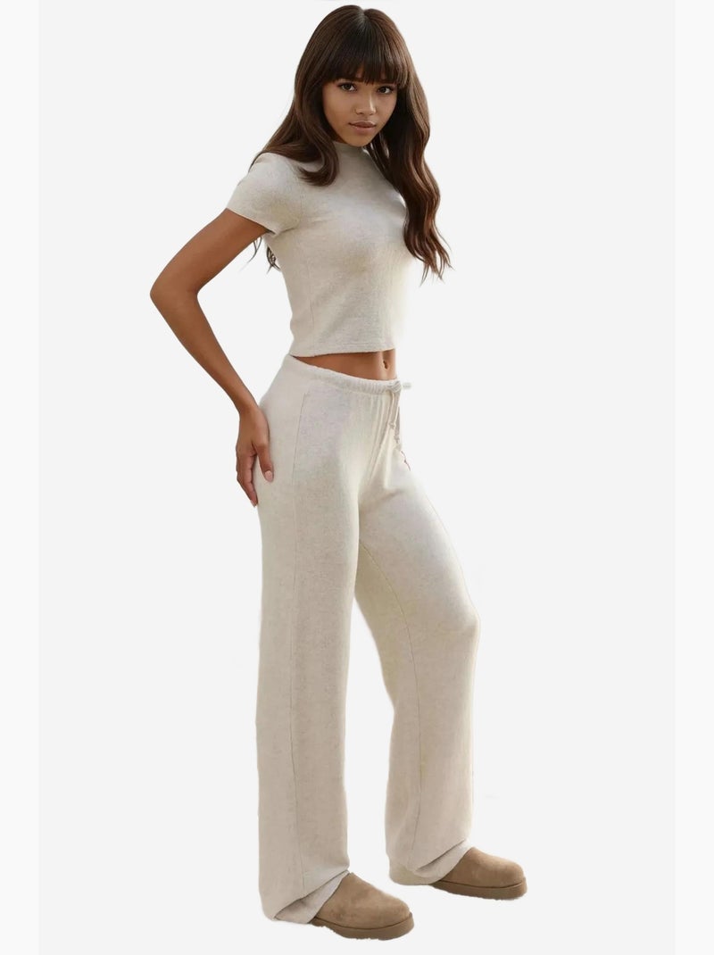 Pantaloni in maglia morbida testurizzata con laccetti hiccup Crema - Kiabi