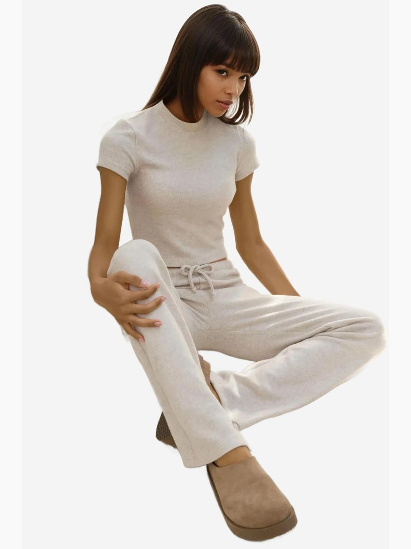 Pantaloni in maglia morbida testurizzata con laccetti hiccup Crema - Kiabi