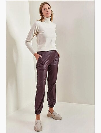 Pantaloni in pelle con elastico in vita e polsini lucci