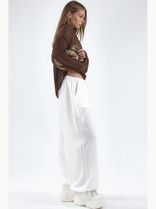 Pantaloni in tessuto a gamba larga con vita a coulisse busem - Kiabi Pantaloni in tessuto a gamba larga con vita a coulisse busem - Kiabi