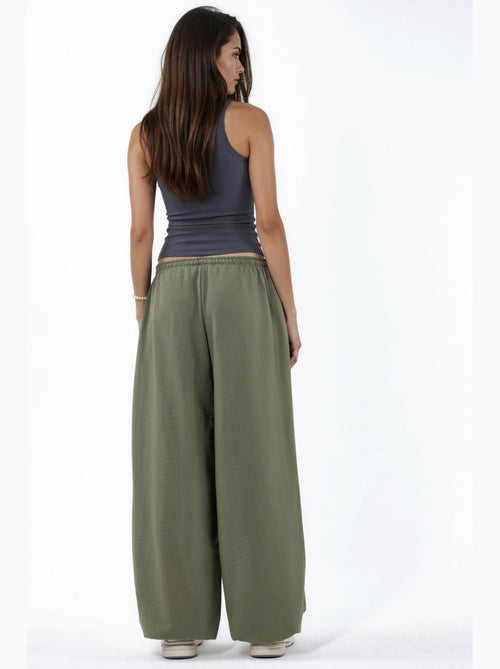Pantaloni in tessuto a gamba larga con vita a coulisse busem - Kiabi Pantaloni in tessuto a gamba larga con vita a coulisse busem - Kiabi