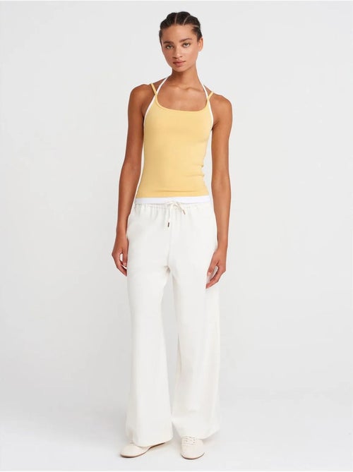 Pantaloni in tessuto a gamba larga con vita con coulisse dilvin - Kiabi Pantaloni in tessuto a gamba larga con vita con coulisse dilvin - Kiabi