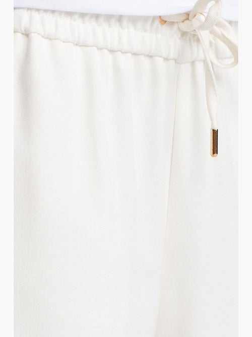 Pantaloni in tessuto a gamba larga con vita con coulisse dilvin - Kiabi Pantaloni in tessuto a gamba larga con vita con coulisse dilvin - Kiabi