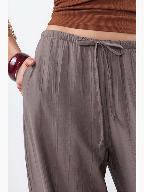 Pantaloni in tessuto a gamba larga da donna busem - Kiabi Pantaloni in tessuto a gamba larga da donna busem - Kiabi