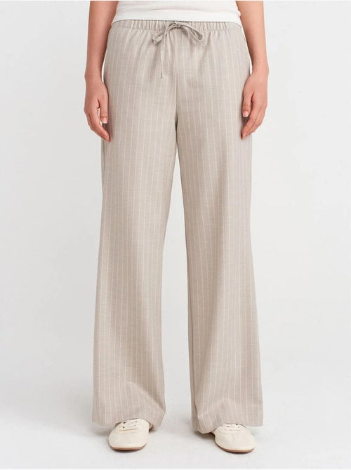 Pantaloni in tessuto a righe a gamba ampia dilvin - Kiabi Pantaloni in tessuto a righe a gamba ampia dilvin - Kiabi