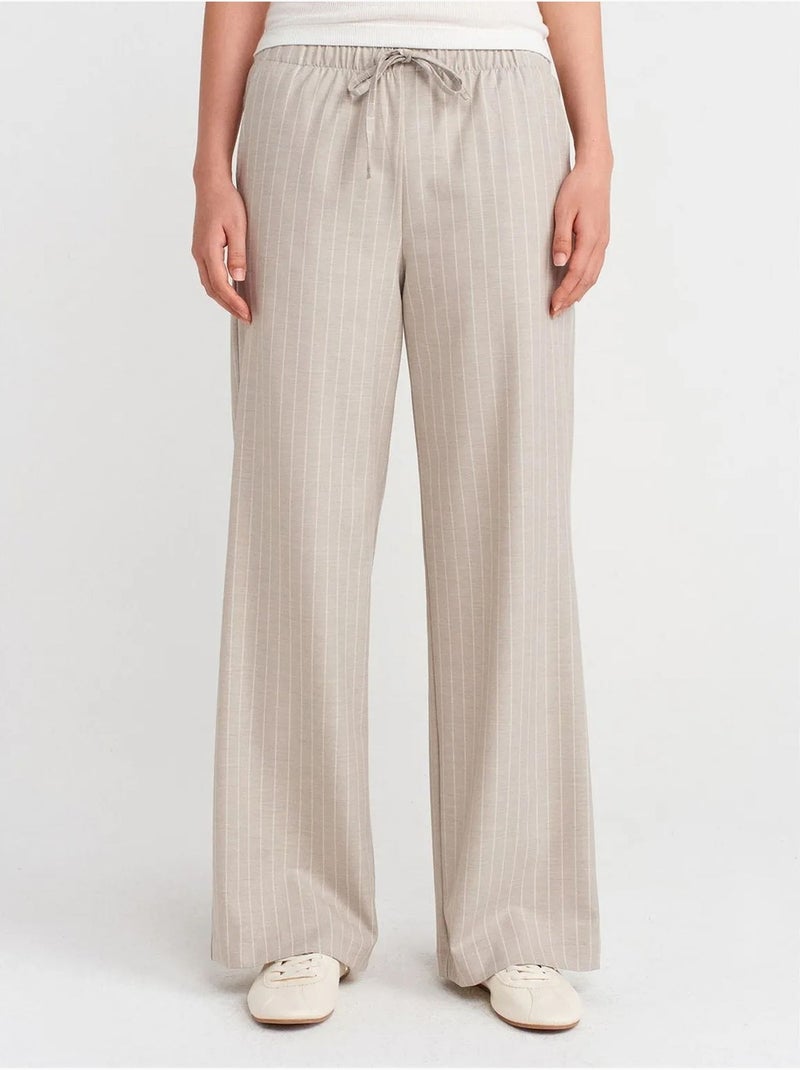 Pantaloni in tessuto a righe a gamba ampia dilvin Sabbia - Kiabi