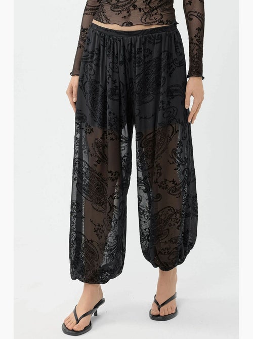 Pantaloni in tulle relaxed fit con stampa flock busem - Kiabi Pantaloni in tulle relaxed fit con stampa flock busem - Kiabi