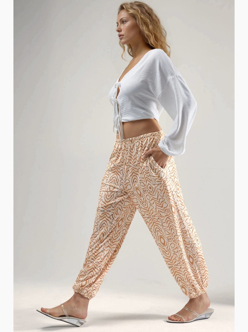 Pantaloni jogger a vita bassa con stampa zebrata hiccup Beige - Kiabi
