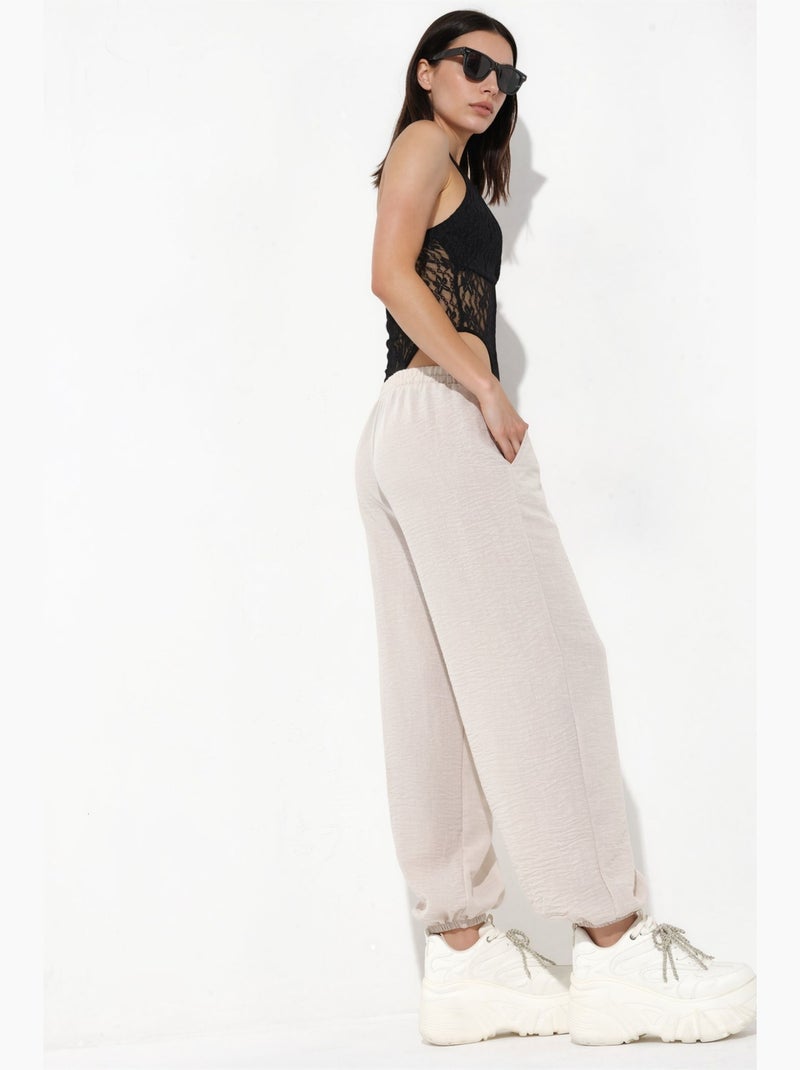 Pantaloni jogger da donna in poliestere testurizzato busem Sabbia - Kiabi