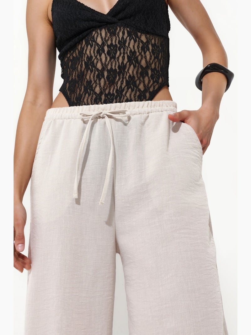 Pantaloni jogger da donna in poliestere testurizzato busem Sabbia - Kiabi