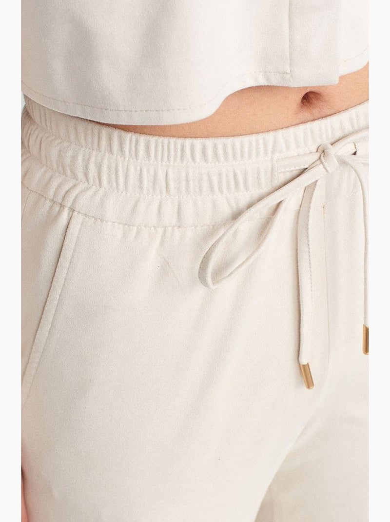 Pantaloni jogger in finta pelle scamosciata dilvin Crema - Kiabi