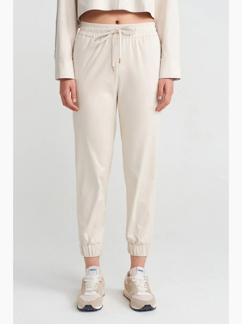 Pantaloni jogger in finta pelle scamosciata dilvin Crema - Kiabi