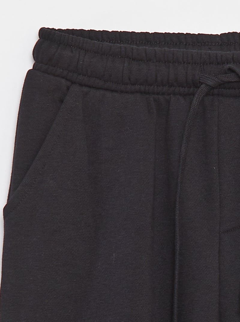 Pantaloni joggers multitasche in tessuto felpato nero - Kiabi