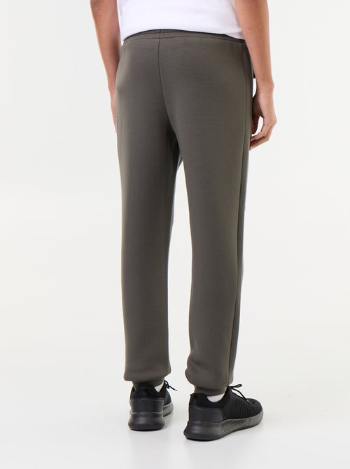 Pantaloni jogging con tasche zippate - Kiabi