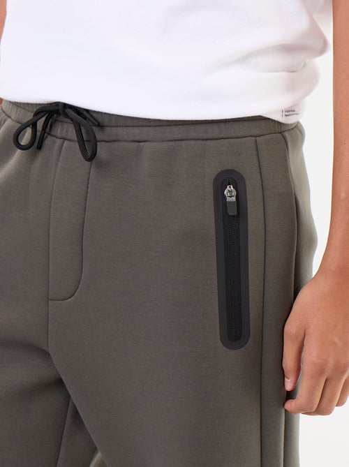 Pantaloni jogging con tasche zippate - Kiabi