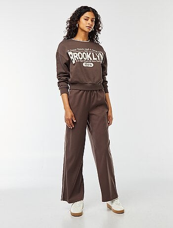 Pantaloni larghi con bordino sul lato