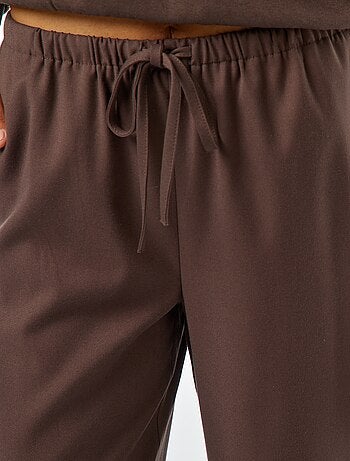 Pantaloni larghi con bordino sul lato