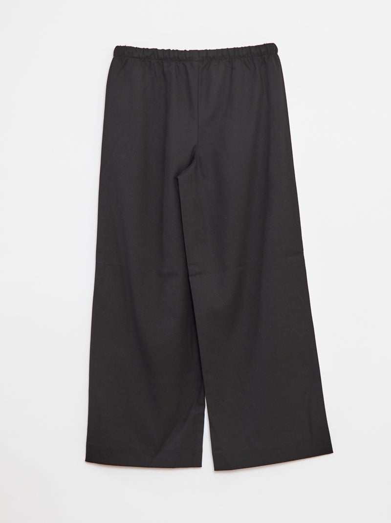 Pantaloni larghi con cintura elasticizzata e 2 tasche nero - Kiabi
