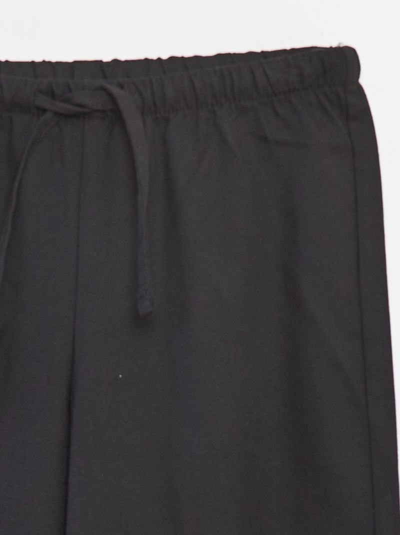 Pantaloni larghi con cintura elasticizzata e 2 tasche nero - Kiabi
