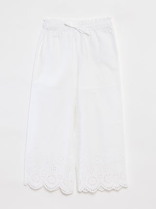 Pantaloni larghi con ricami a punto inglese