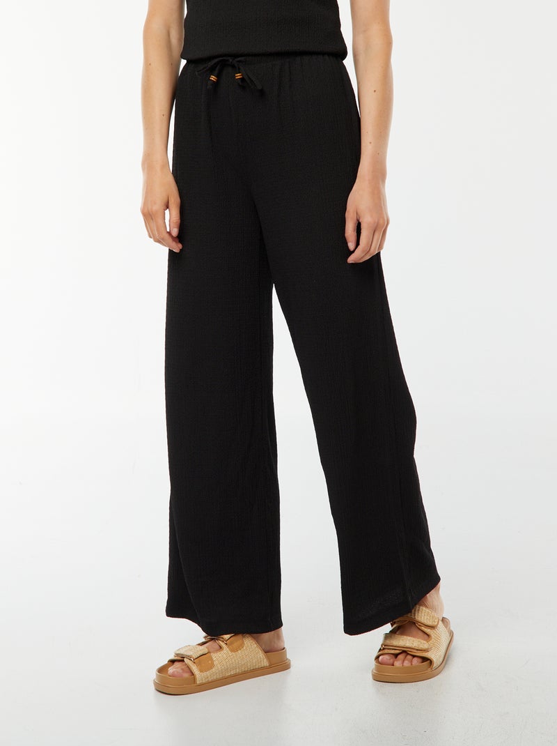 Pantaloni larghi in tessuto goffrato nero - Kiabi