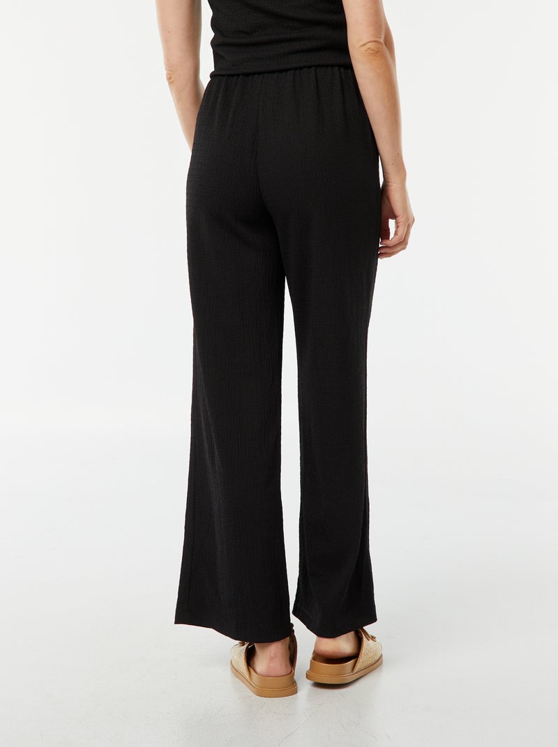 Pantaloni larghi in tessuto goffrato nero - Kiabi