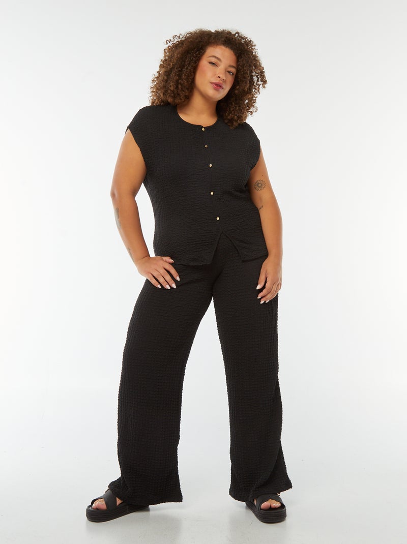 Pantaloni larghi in tessuto goffrato nero - Kiabi