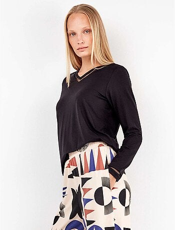 Pantaloni lunghi con motivi geometrici e bordi sul fondo