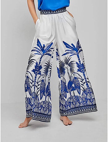Pantaloni lunghi e larghi con stampa tropicale