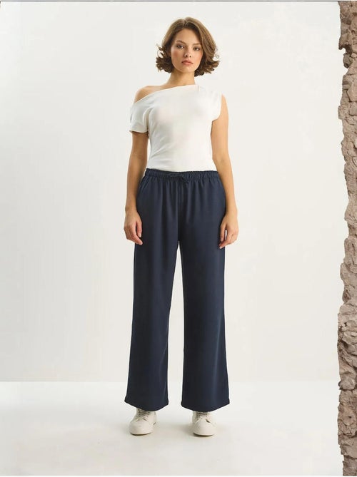 Pantaloni palazzo a gamba ampia con chiusura a laccio lucci - Kiabi Pantaloni palazzo a gamba ampia con chiusura a laccio lucci - Kiabi