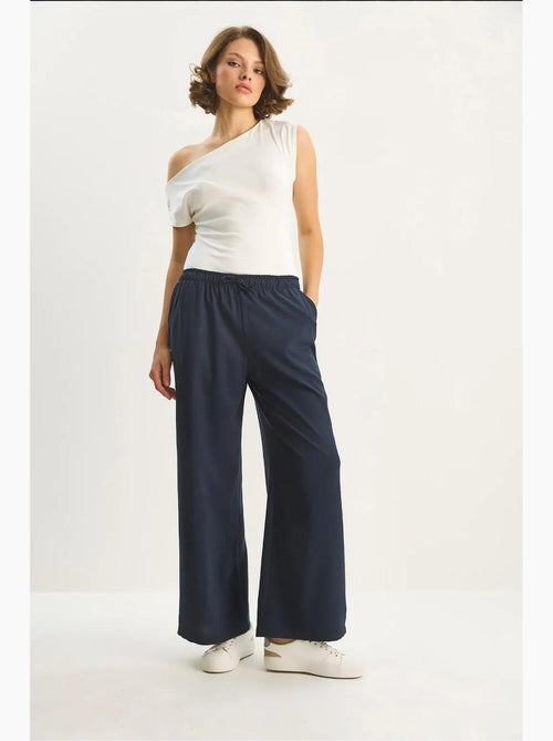 Pantaloni palazzo a gamba ampia con chiusura a laccio lucci - Kiabi Pantaloni palazzo a gamba ampia con chiusura a laccio lucci - Kiabi