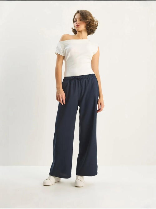 Pantaloni palazzo a gamba ampia con chiusura a laccio lucci - Kiabi Pantaloni palazzo a gamba ampia con chiusura a laccio lucci - Kiabi
