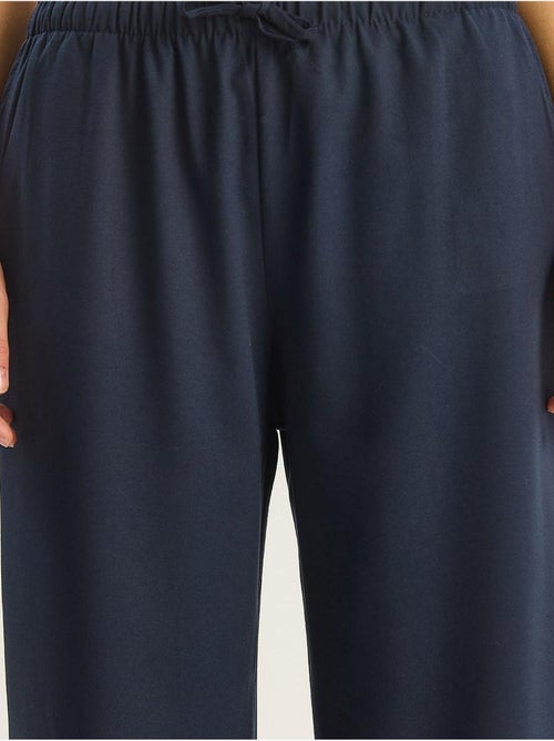 Pantaloni palazzo a gamba ampia con chiusura a laccio lucci - Kiabi Pantaloni palazzo a gamba ampia con chiusura a laccio lucci - Kiabi