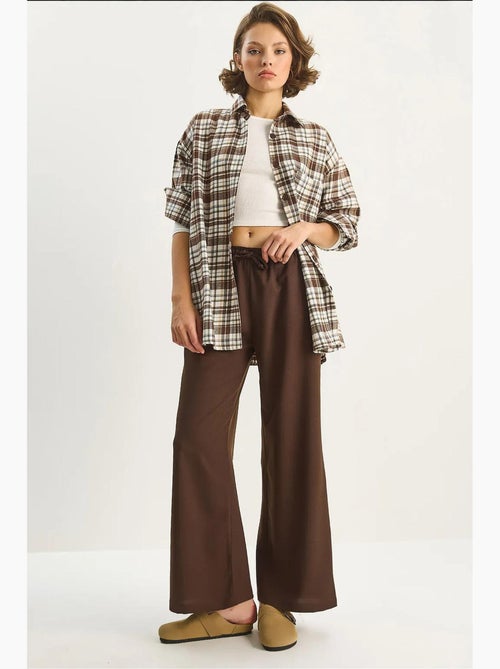 Pantaloni palazzo a gamba ampia con chiusura a laccio lucci - Kiabi Pantaloni palazzo a gamba ampia con chiusura a laccio lucci - Kiabi
