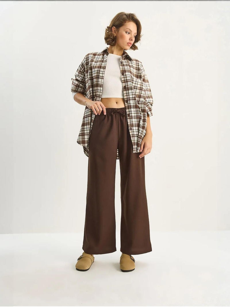 Pantaloni palazzo a gamba ampia con chiusura a laccio lucci Marrone scuro - Kiabi