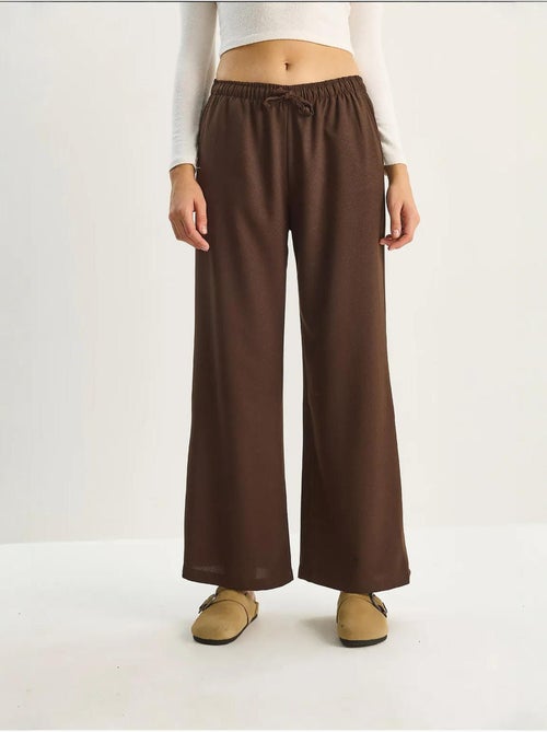 Pantaloni palazzo a gamba ampia con chiusura a laccio lucci - Kiabi Pantaloni palazzo a gamba ampia con chiusura a laccio lucci - Kiabi