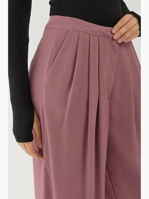 Pantaloni palazzo a gamba ampia con pieghe hiccup - Kiabi Pantaloni palazzo a gamba ampia con pieghe hiccup - Kiabi