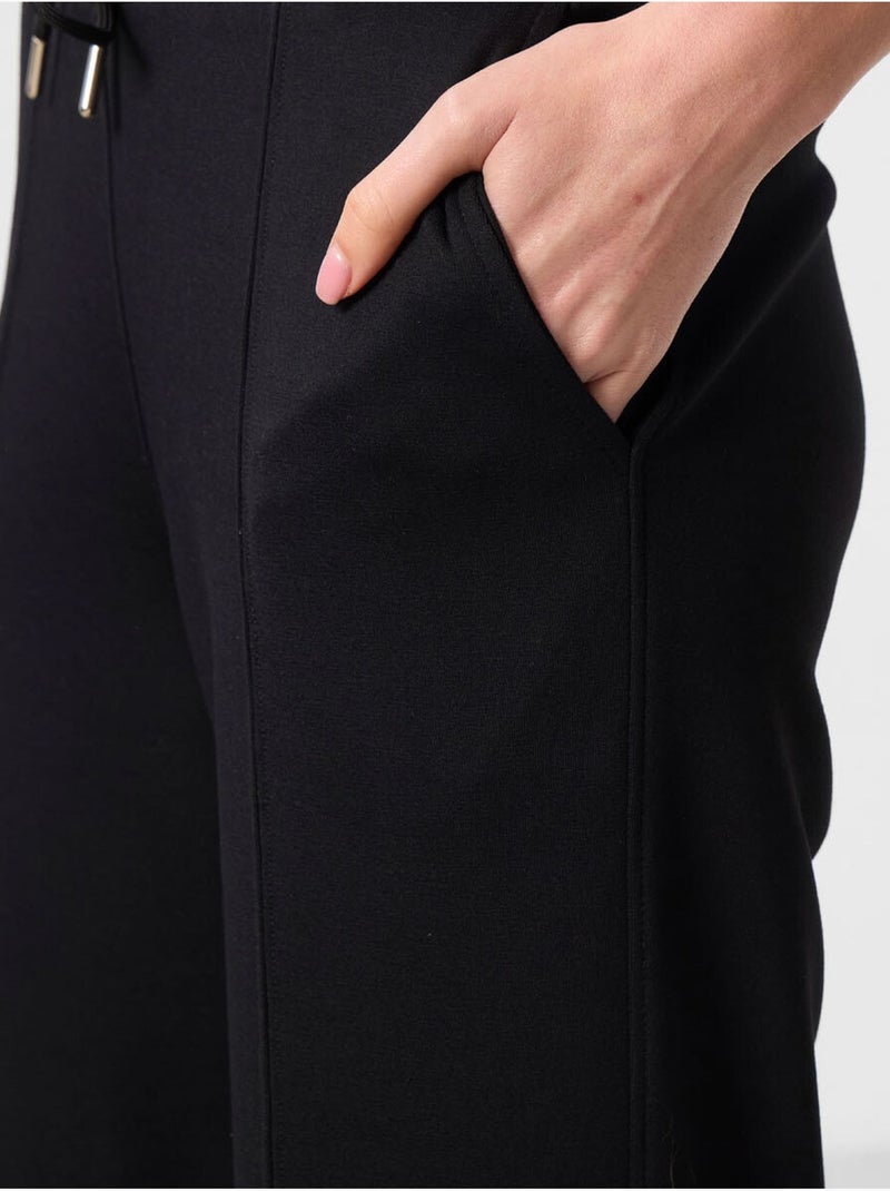 Pantaloni palazzo a gamba ampia testurizzati con vita con coulisse tommy Nero - Kiabi